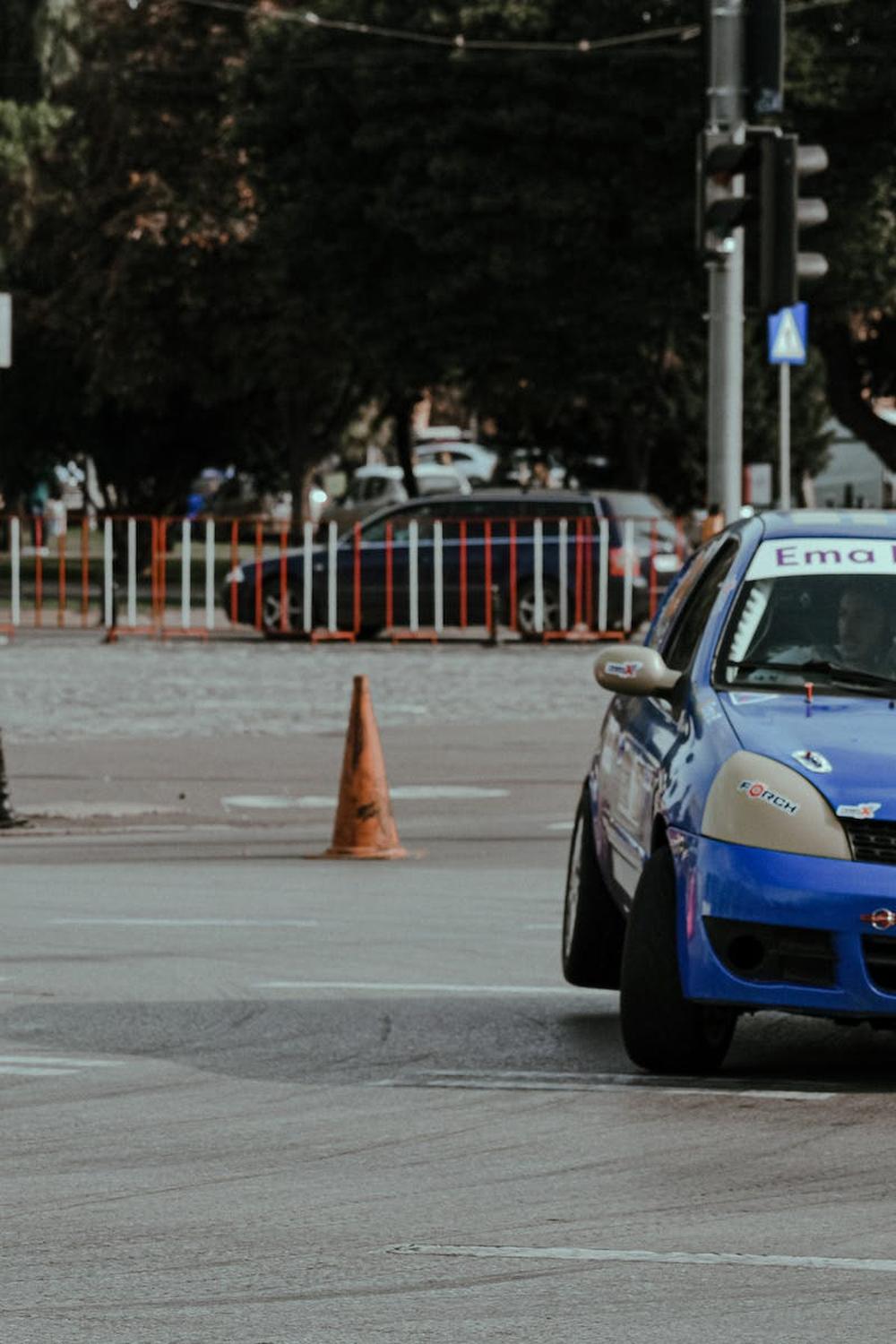 small_rally_car_driving_in_city